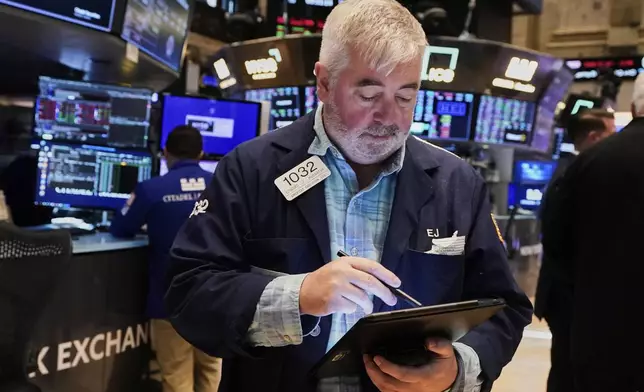 Trader Edward McCarthy works on the floor of the New York Stock Exchange, Tuesday, May 20, 2025. (AP Photo/Richard Drew)