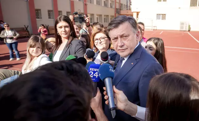 Presidential candidate Crin Antonescu speaks to media after casting his vote in the first round of the presidential election redo in Bucharest, Romania, Sunday, May 4, 2025. (AP Photo/Andreea Alexandru)