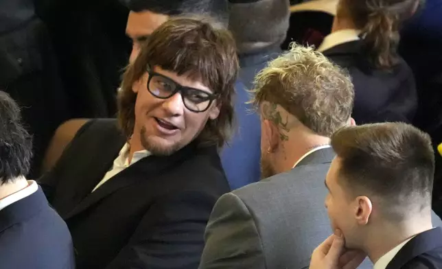 FILE - Theo Von, left speaks with Jake Paul in Emancipation Hall at the 60th Presidential Inauguration, Jan. 20, 2025, at the U.S. Capitol in Washington. (Jasper Colt/Pool Photo via AP, File)