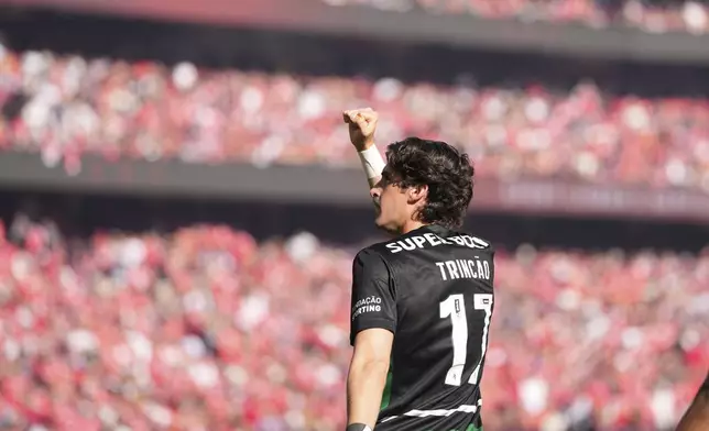 Sporting's Francisco Trincao celebrates scoring his side's opening goal during a Portuguese league soccer match between SL Benfica and Sporting CP at the Luz stadium in Lisbon, Saturday, May 10, 2025. (AP Photo/Armando Franca)