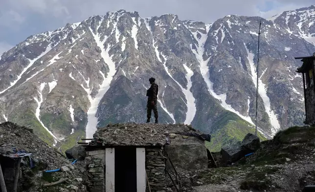 An Indian army soldier keeps a vigil from one of the forward post along the line of control between India and Pakistan during a media tour somewhere in north of Indian-controlled Kashmir, Monday, May 19, 2025. (AP Photo/Mukhtar Khan)
