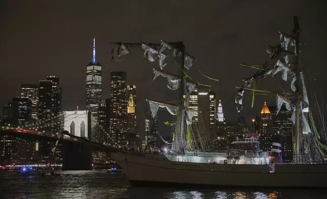 A masted Mexican Navy training ship, the Cuauhtémoc, sits stranded after colliding with the Brooklyn Bridge, Saturday, May 17, 2025, in New York. (AP Photo/Yuki Iwamura)