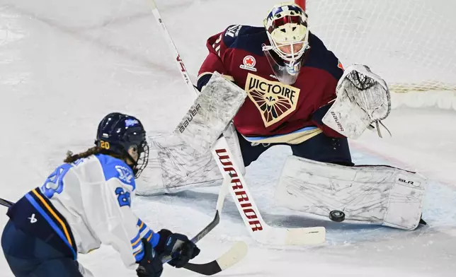 FILE - Montreal Victoire goaltender Elaine Chuli, right, stops Toronto Sceptres' Sarah Nurse (20) during third-period PWHL hockey game action in Laval, Quebec, Sunday, March 23, 2025. (Graham Hughes/The Canadian Press via AP, File)