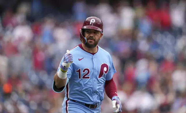 Philadelphia Phillies' Kyle Schwarber reacts after hitting a home run against Atlanta Braves pitcher Pierce Johnson during the seventh inning in the first baseball game of a doubleheader Thursday, May 29, 2025, in Philadelphia. (AP Photo/Matt Slocum)