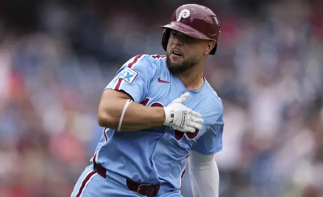 Philadelphia Phillies' Rafael Marchán reacts after hitting a two-run home run against Atlanta Braves pitcher AJ Smith-Shawver during the third inning in the first baseball game of a doubleheader Thursday, May 29, 2025, in Philadelphia. (AP Photo/Matt Slocum)