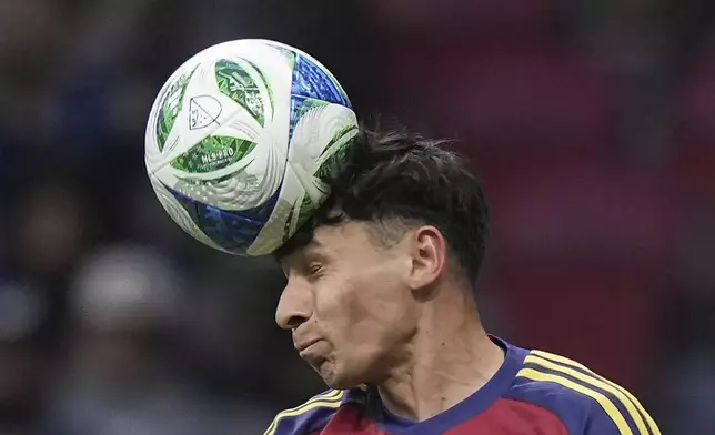Real Salt Lake's Noel Caliskan gets his head on the ball during the second half of an MLS soccer match against the Vancouver Whitecaps, in Vancouver, on Saturday, May 3, 2025. (Darryl Dyck/The Canadian Press via AP)