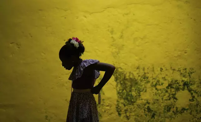 A youth dresses up to take part in the Devils and Congos Festival in Portobelo, Panama, Saturday, May 3, 2025. (AP Photo/Matias Delacroix)