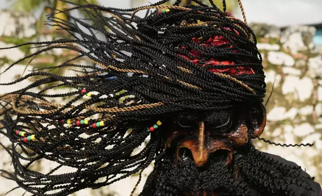 Revelers take part in the Devils and Congos Festival in Portobelo, Panama, Saturday, May 3, 2025. (AP Photo/Matias Delacroix)