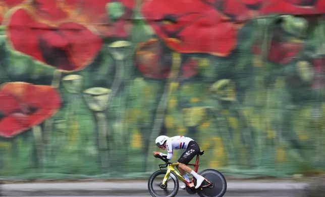Britain's Joshua Michael Tarling pedals during the time trial stage 2 of the Giro d'Italia cycling race, in Tirana, Albania, Saturday, May 10, 2025. (Fabio Ferrari/LaPresse via AP)