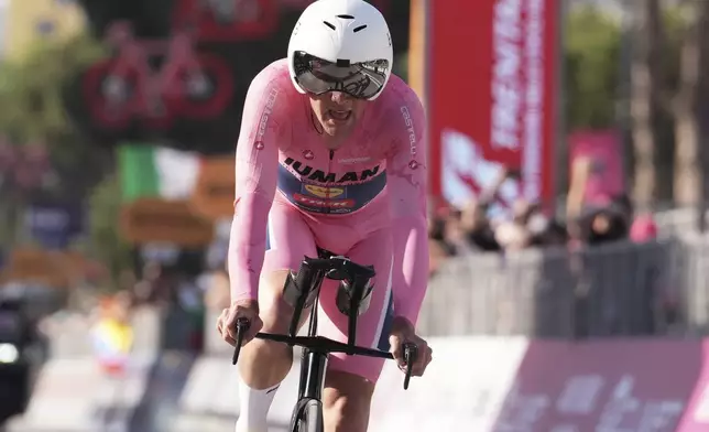 Denmark's Mads Pedersen wears the pink jersey of the overall leader during the time trial stage 2 of the Giro d'Italia cycling race, in Tirana, Albania, Saturday, May 10, 2025. (Massimo Paolone/LaPresse via AP)
