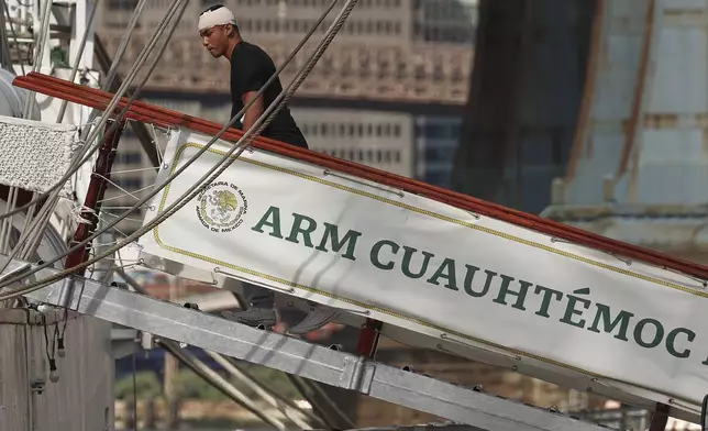 A sailor arrives back at the Cuauhtémoc, Sunday, May 18, 2025 in New York, a masted Mexican Navy training ship that collided with the Brooklyn Bridge the night before. (AP Photo/Yuki Iwamura)