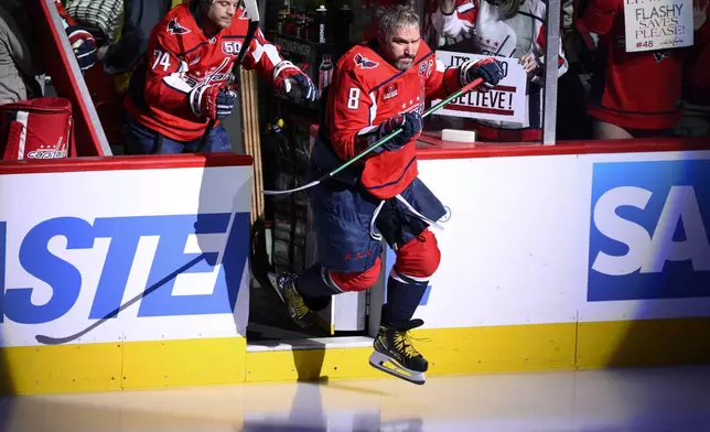 Washington Capitals left wing Alex Ovechkin (8) takes to the ice for warmups before Game 5 of a second-round NHL hockey playoff series against the Carolina Hurricanes Thursday, May 15, 2025, in Washington. (AP Photo/Nick Wass)