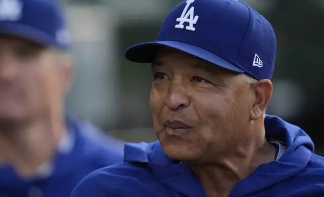Los Angeles Dodgers manager Dave Roberts stands in the dugout during the first inning of a baseball game against the Chicago Cubs, Wednesday, April 23, 2025, in Chicago. (AP Photo/Erin Hooley)