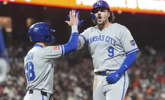 Kansas City Royals' Vinnie Pasquantino (9) celebrates after hitting a two-run home run that also scored Cavan Biggio (18) during the eighth inning of a baseball game against the San Francisco Giants in San Francisco, Monday, May 19, 2025. (AP Photo/Jeff Chiu)