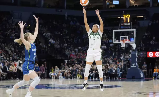 Seattle Storm guard Zia Cooke (7) shoots over Minnesota Lynx forward Karlie Samuelson (44) during the second half of a WNBA basketball game Tuesday, May 27, 2025, in Minneapolis. (AP Photo/Abbie Parr)