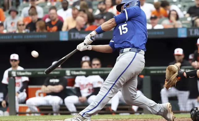 Kansas City Royals' Luke Maile hits a home run during the eighth inning of a baseball game against the Baltimore Orioles, Sunday, May 4, 2025, in Baltimore. (AP Photo/Daniel Kucin Jr.)