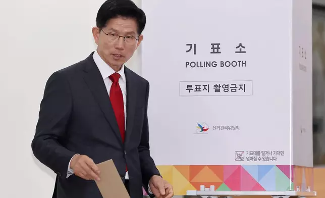 South Korean People Power Party's presidential candidate Kim Moon Soo exits out to cast his early vote for the June 3 presidential election at a polling station in Incheon, South Korea, Thursday, May 29, 2025. (Ryu Young-seok/Yonhap via AP)