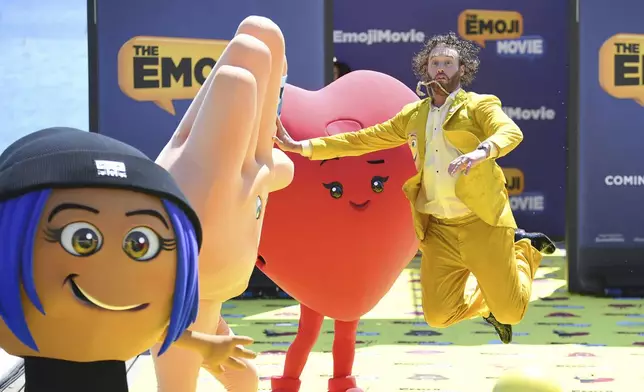 FILE - Actor T. J. Miller poses with characters during the photo call for the film The Emoji Movie, at the 70th international film festival, Cannes, southern France, Tuesday, May 16, 2017. (Photo by Arthur Mola/Invision/AP, File)