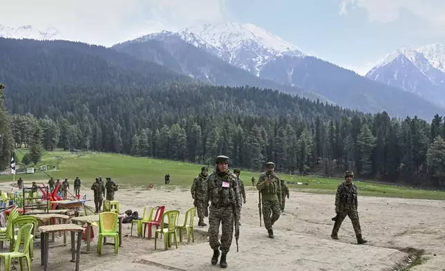 FILE - Indian security officers inspect the site a day after where militants indiscriminately opened fire at tourists in Pahalgam, Indian controlled Kashmir, Wednesday, April 23, 2025. (AP Photo, File)