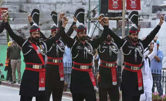 Pakistan's Rangers soldiers gesture during a daily closing ceremony at the Wagah, a joint post on the Pakistan and India border, near Lahore, Pakistan, Saturday, May 3, 2025. (AP Photo/K.M. Chaudary)