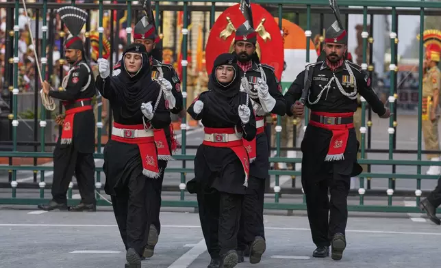 Pakistan's Rangers soldiers march during a daily closing ceremony at the Wagah, a joint post on the Pakistan and India border, near Lahore, Pakistan, Saturday, May 3, 2025. (AP Photo/K.M. Chaudary)