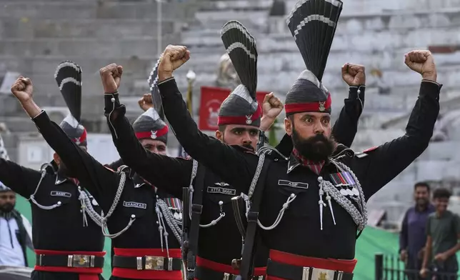 Pakistan's Rangers soldiers gesture during a daily closing ceremony at the Wagah, a joint post on the Pakistan and India border, near Lahore, Pakistan, Saturday, May 3, 2025. (AP Photo/K.M. Chaudary)