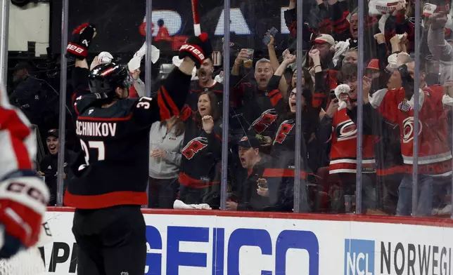 Carolina Hurricanes' Andrei Svechnikov (37) celebrates his goal against the Washington Capitals during the second period of Game 3 of an NHL hockey Semi-final round playoff series in Raleigh, N.C., Saturday, May 10, 2025. (AP Photo/Karl DeBlaker)