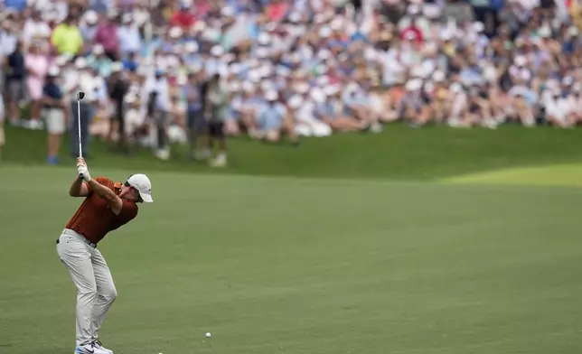 Rory McIlroy, of Northern Ireland, hits from the fairway on the second hole during the second round of the PGA Championship golf tournament at the Quail Hollow Club, Friday, May 16, 2025, in Charlotte, N.C. (AP Photo/David J. Phillip)