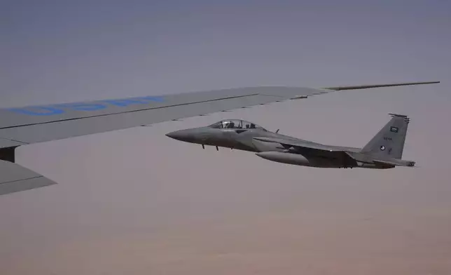 Saudi Air Force F-15 warplanes escort Air Force One carrying President Donald Trump as it arrives in Saudi Arabia, Tuesday, May 13, 2025. (AP Photo/Alex Brandon)