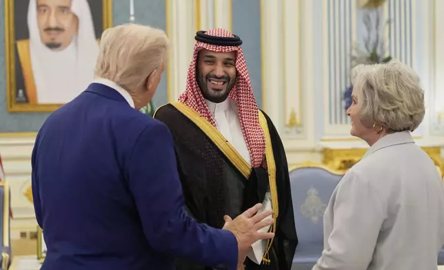President Donald Trump, left, Saudi Crown Prince Mohammed bin Salman, center, and White House Chief of Staff Susie Wiles speak at the Royal Palace in Riyadh, Saudi Arabia, Tuesday, May 13, 2025. (AP Photo/Alex Brandon)