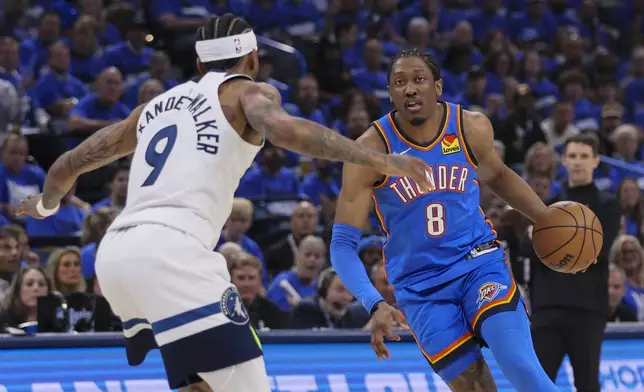 Oklahoma City Thunder forward Jalen Williams (8) drives against Minnesota Timberwolves guard Nickeil Alexander-Walker (9) during the first half of Game 2 of an NBA basketball Western Conference Finals playoff series Thursday, May 22, 2025, in Oklahoma City. (AP Photo/Nate Billings)