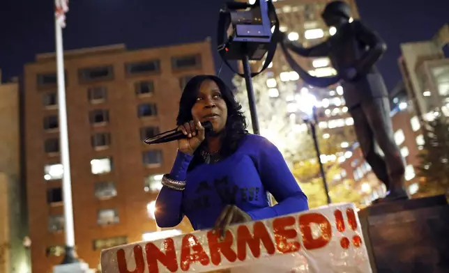 FILE - Tawanda Jones leads a vigil outside of Baltimore City Hall on Oct. 21, 2015, for her brother, Tyrone West, who died during an encounter with police. (AP Photo/Patrick Semansky, File)