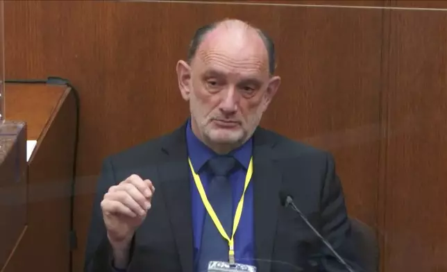 FILE - In this image from video, Dr. David Fowler, a retired forensic pathologist and former chief medical examiner for the state of Maryland testifies as Hennepin County Judge Peter Cahill presides, on April 14, 2021, in the trial of former Minneapolis police Officer Derek Chauvin at the Hennepin County Courthouse in Minneapolis, Minn. Chauvin is charged in the May 25, 2020 death of George Floyd. (Court TV via AP, Pool, File)