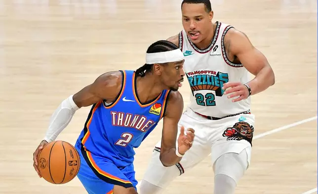 Oklahoma City Thunder guard Shai Gilgeous-Alexander (2) handles the ball against Memphis Grizzlies guard Desmond Bane (22) in the second half of Game 3 of an NBA first-round playoff series Thursday, April 24, 2025, in Memphis, Tenn. (AP Photo/Brandon Dill)
