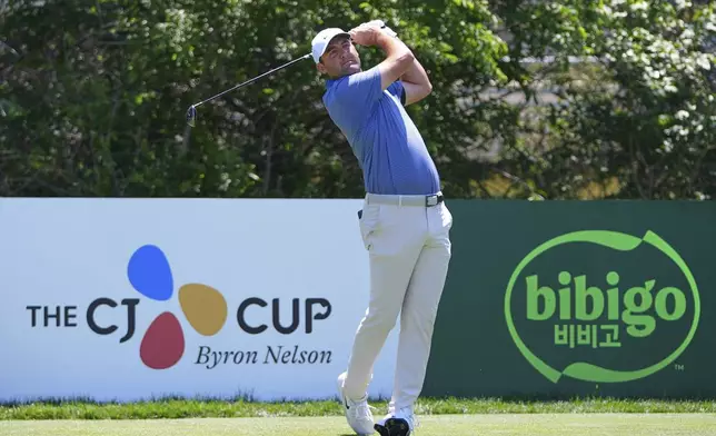 Scottie Scheffler watches his tee shot on the third hole during the final round of the CJ Cup Byron Nelson golf tournament in McKinney, Texas, Sunday, May 4, 2025. (AP Photo/LM Otero)
