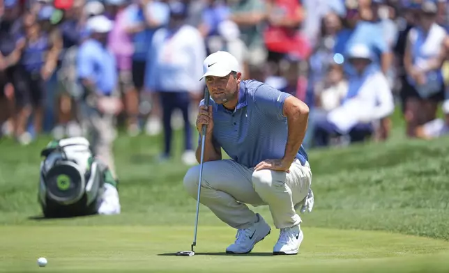 Scottie Scheffler prepares to putt on the first hole during the final round of the CJ Cup Byron Nelson golf tournament in McKinney, Texas, Sunday, May 4, 2025. (AP Photo/LM Otero)