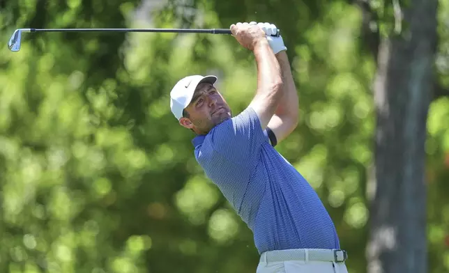 Scottie Scheffler watches his tee shot on the sixth hole during the final round of the CJ Cup Byron Nelson golf tournament in McKinney, Texas, Sunday, May 4, 2025. (AP Photo/LM Otero)