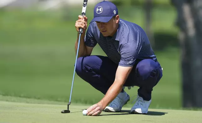 Jordan Spieth sets up for a putt on the first green during the final round of the CJ Cup Byron Nelson golf tournament in McKinney, Texas, Sunday, May 4, 2025. (AP Photo/LM Otero)