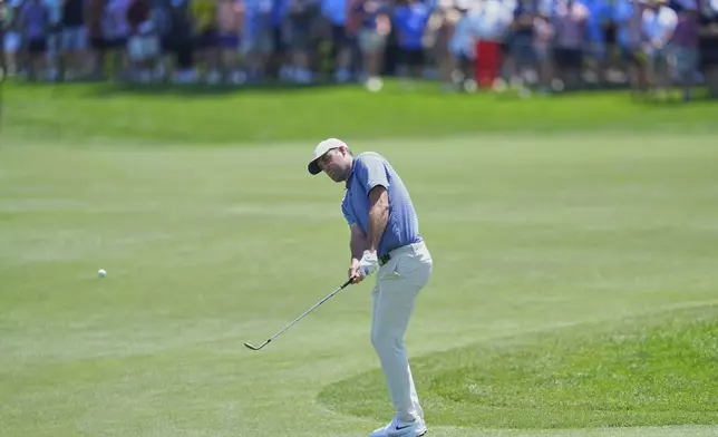 Scottie Scheffler hits onto the sixth green during the final round of the CJ Cup Byron Nelson golf tournament in McKinney, Texas, Sunday, May 4, 2025. (AP Photo/LM Otero)