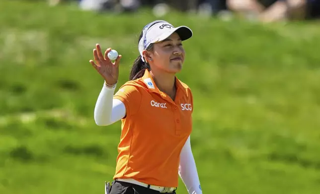 Jeeno Thitikul, of Thailand, reacts after winning the Mizuho Americas Open LPGA golf tournament, Sunday, May 11, 2025, in Jersey City, N.J. (AP Photo/Seth Wenig)