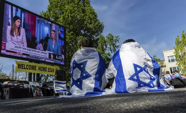 Residents and friends gather in Huyler Park ahead of the release of American hostage Edan Alexander from Hamas on Monday, May 12, 2025 in Tenafly, N.J. (AP Photo/Stefan Jeremiah)