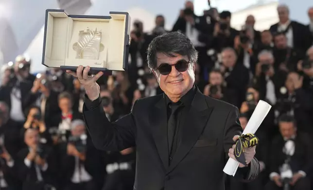 Director Jafar Panahi, winner of the Palme d'Or for the film 'It Was Just an Accident', poses for photographers at the awards ceremony photo call at the 78th international film festival, Cannes, southern France, Saturday, May 24, 2025. (AP Photo/Natacha Pisarenko)