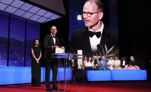 Director Joachim Trier, accepts the grand prix for 'Sentimental Value', during the awards ceremony of the 78th international film festival, Cannes, southern France, Saturday, May 24, 2025. (Photo by Joel C Ryan/Invision/AP)