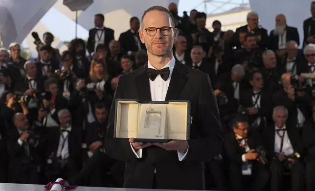 Director Joachim Trier, winner of the grand prix for the film 'Sentimental Value', poses for photographers at the awards ceremony photo call at the 78th international film festival, Cannes, southern France, Saturday, May 24, 2025. (AP Photo/Natacha Pisarenko)