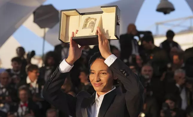 Nadia Melliti, winner of the award for best actress for the film 'The Little Sister', poses for photographers at the awards ceremony photo call at the 78th international film festival, Cannes, southern France, Saturday, May 24, 2025. (AP Photo/Natacha Pisarenko)