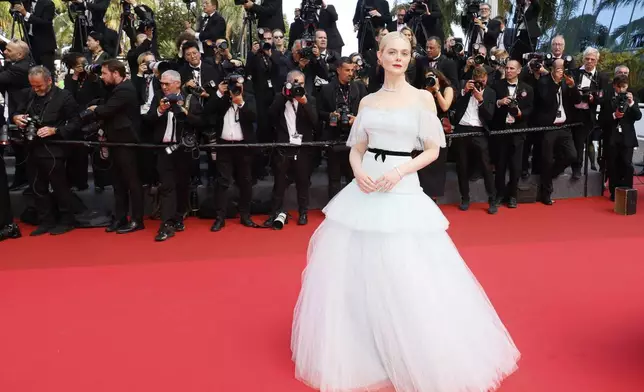Elle Fanning poses for photographers during the awards ceremony red carpet at the 78th international film festival, Cannes, southern France, Saturday, May 24, 2025. (Photo by Joel C Ryan/Invision/AP)