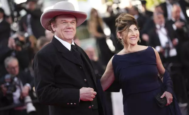 John C. Reilly, left, and Alison Dickey pose for photographers during the awards ceremony red carpet at the 78th international film festival, Cannes, southern France, Saturday, May 24, 2025. (Photo by Scott A Garfitt/Invision/AP)