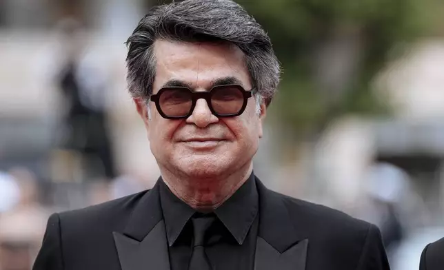 Director Jafar Panahi poses for photographers upon arrival at the premiere of the film 'It Was Just an Accident' at the 78th international film festival, Cannes, southern France, Tuesday, May 20, 2025. (Photo by Lewis Joly/Invision/AP)