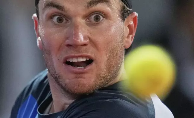 Jack Draper, of Britain, watches the ball during his match against Lorenzo Musetti, of Italy, during the men's semifinal at the Madrid Open tennis tournament in Madrid, Spain, Friday, May 2, 2025. (AP Photo/Manu Fernandez)