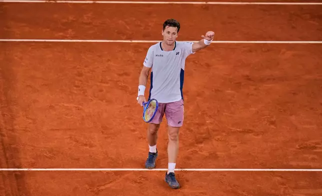 Casper Ruud of Norway celebrates after winning against Francisco Cerundolo from Argentina during men's semifinal at the Madrid Open tennis tournament in Madrid, Spain, Friday, May 2, 2025. (AP Photo/Manu Fernandez)